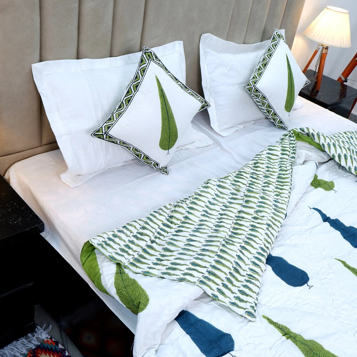 Jaipuri block print quilt set featuring green leaf patterns designed for a stylish bedroom decor